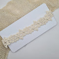 Baby haarband kant met pareltjes en strik
