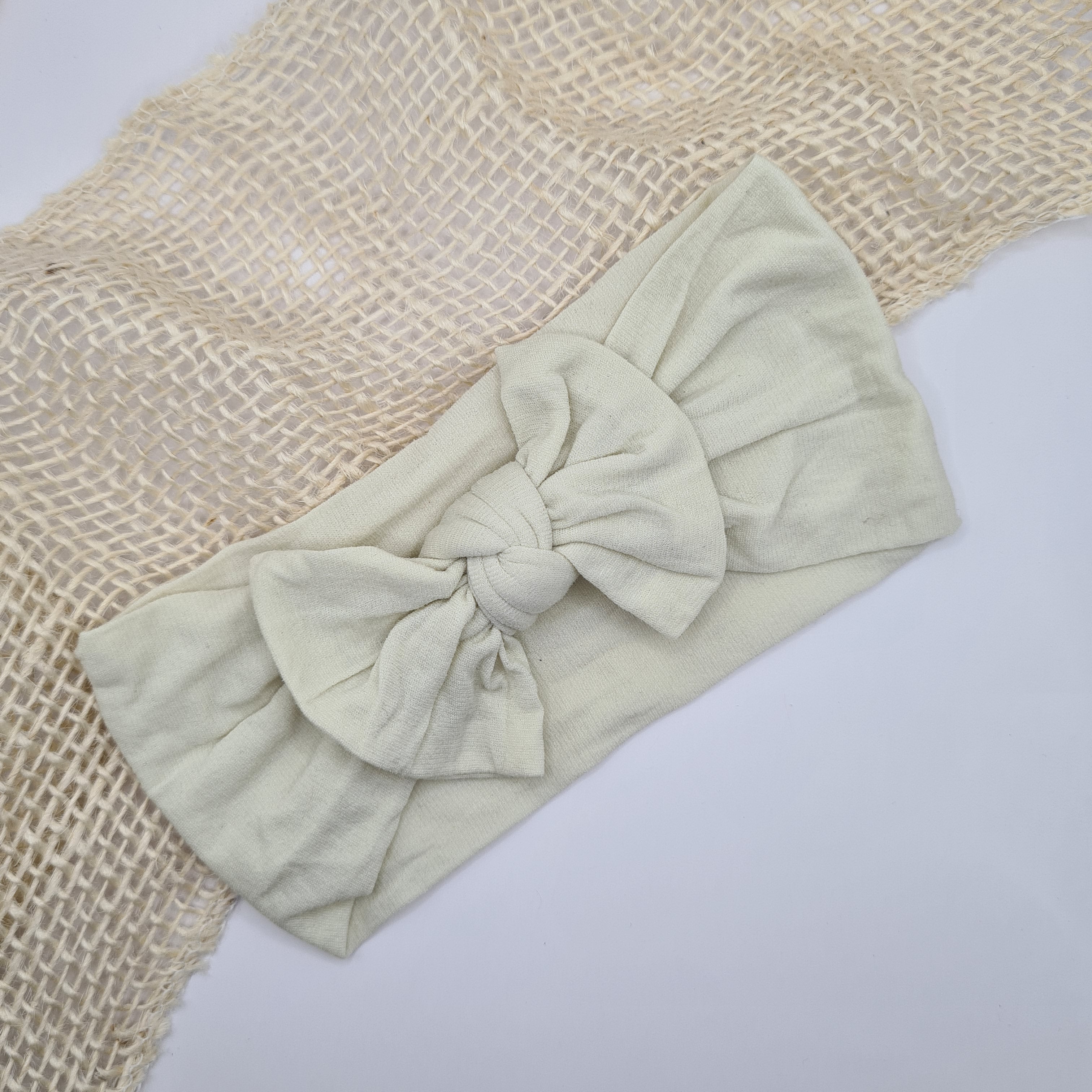 Zachte nylon haarband met strik crème