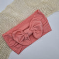 Zachte nylon haarband met strik roze