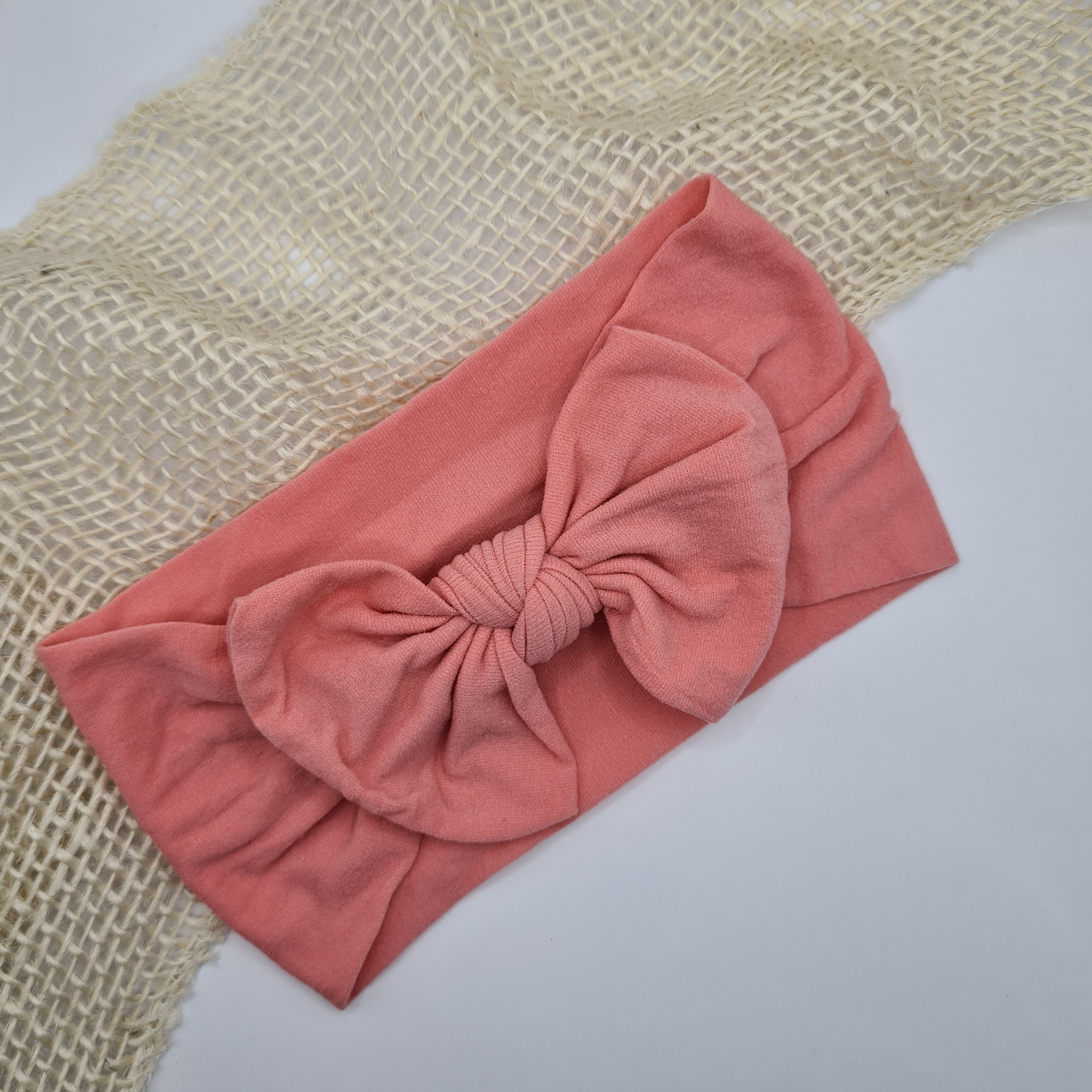 Zachte nylon haarband met strik roze