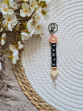Sleutelhanger met bloem perzik kleur