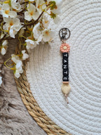 Sleutelhanger met bloem perzik kleur