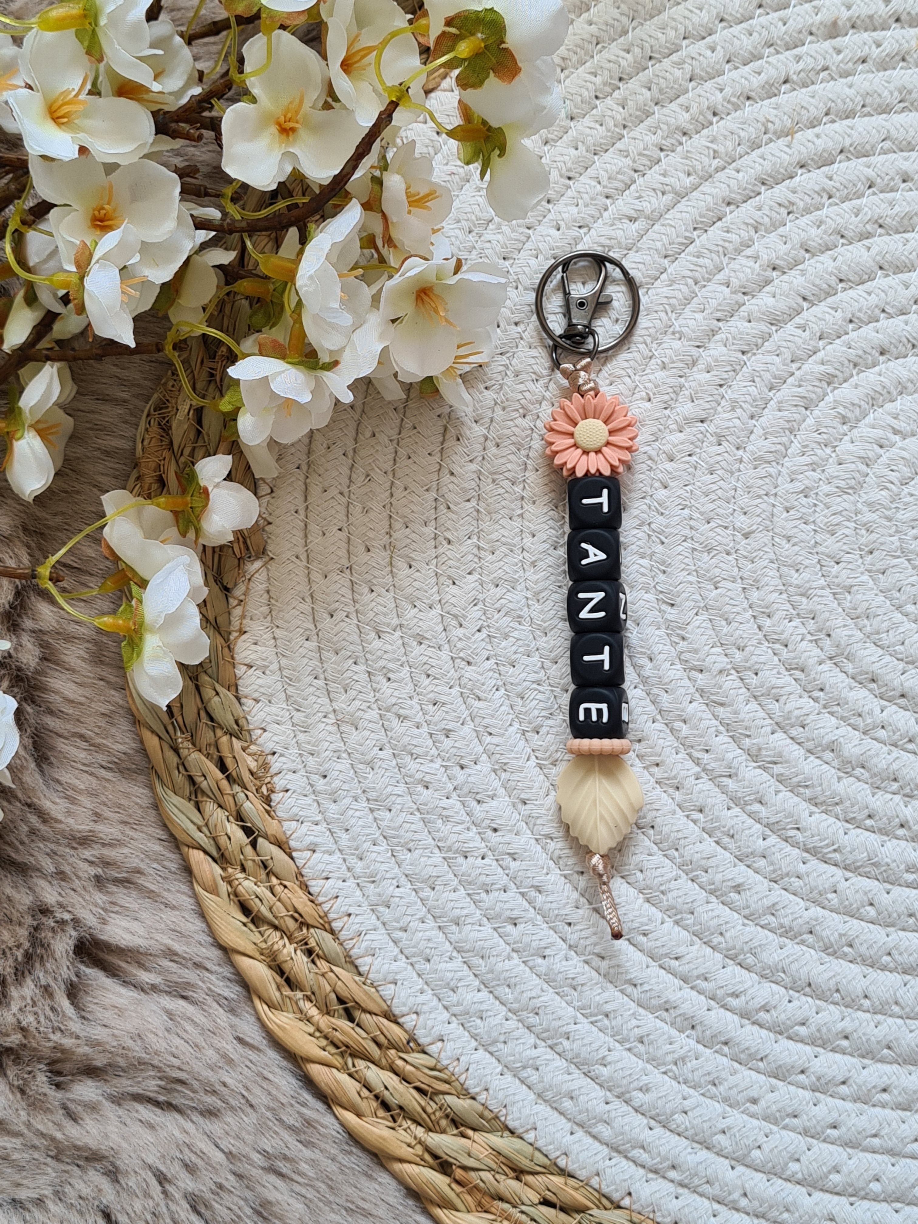 Sleutelhanger met bloem perzik kleur