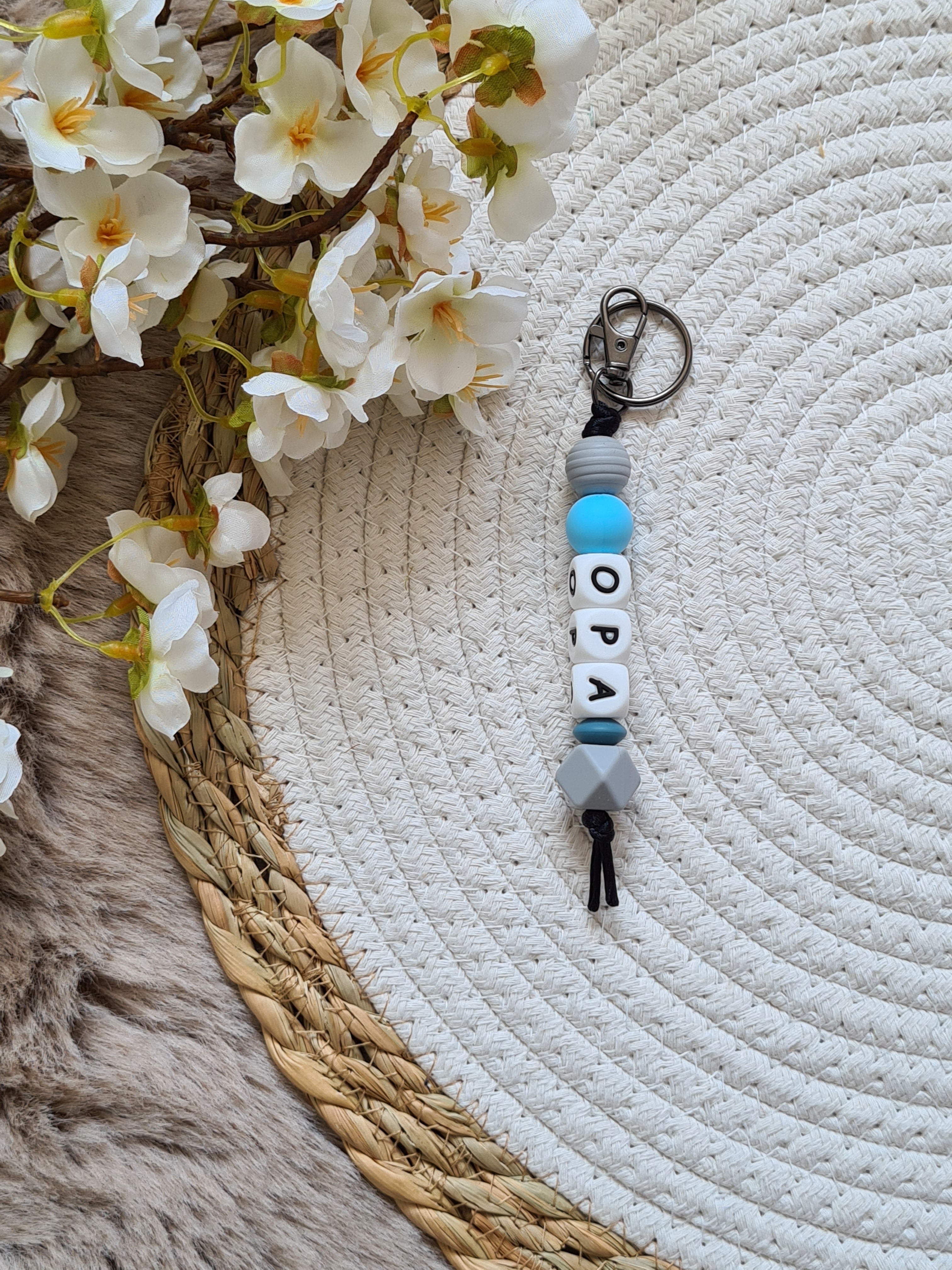 Sleutelhanger grijs met blauw detail