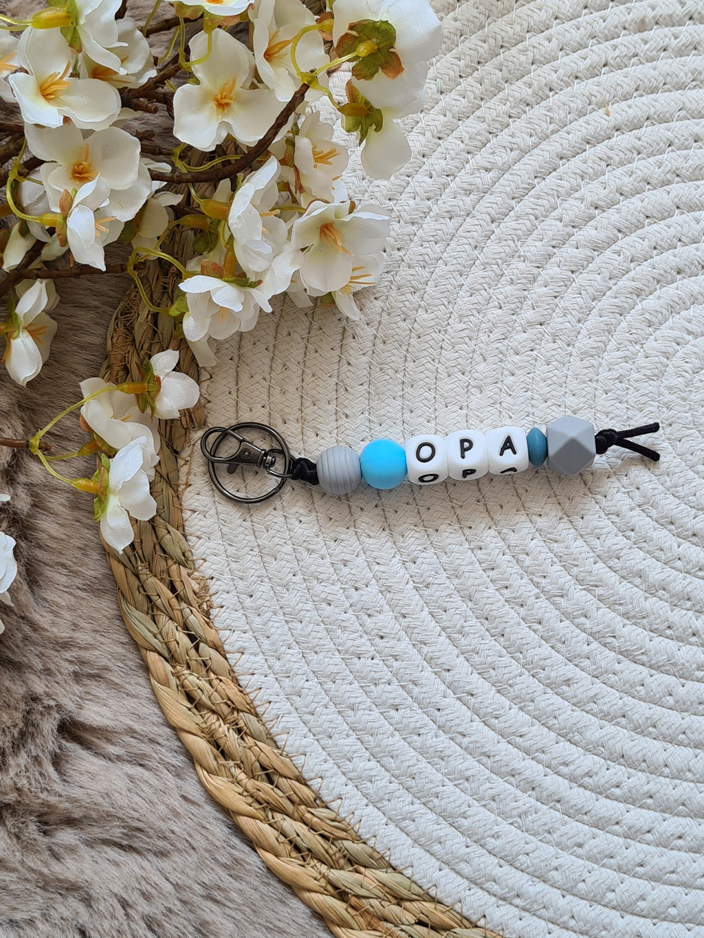 Sleutelhanger grijs met blauw detail