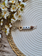 Sleutelhanger bloem beige
