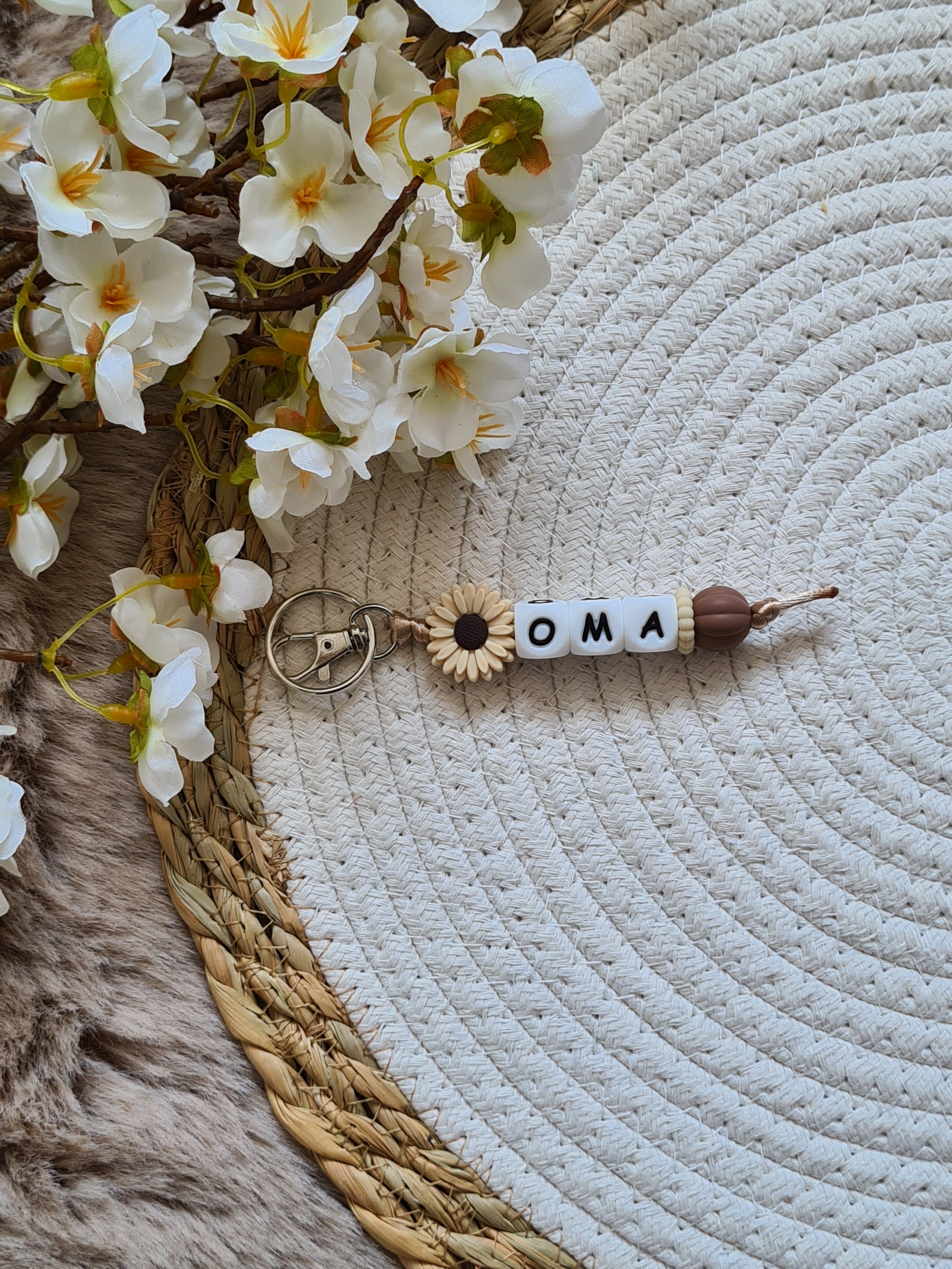 Sleutelhanger bloem beige