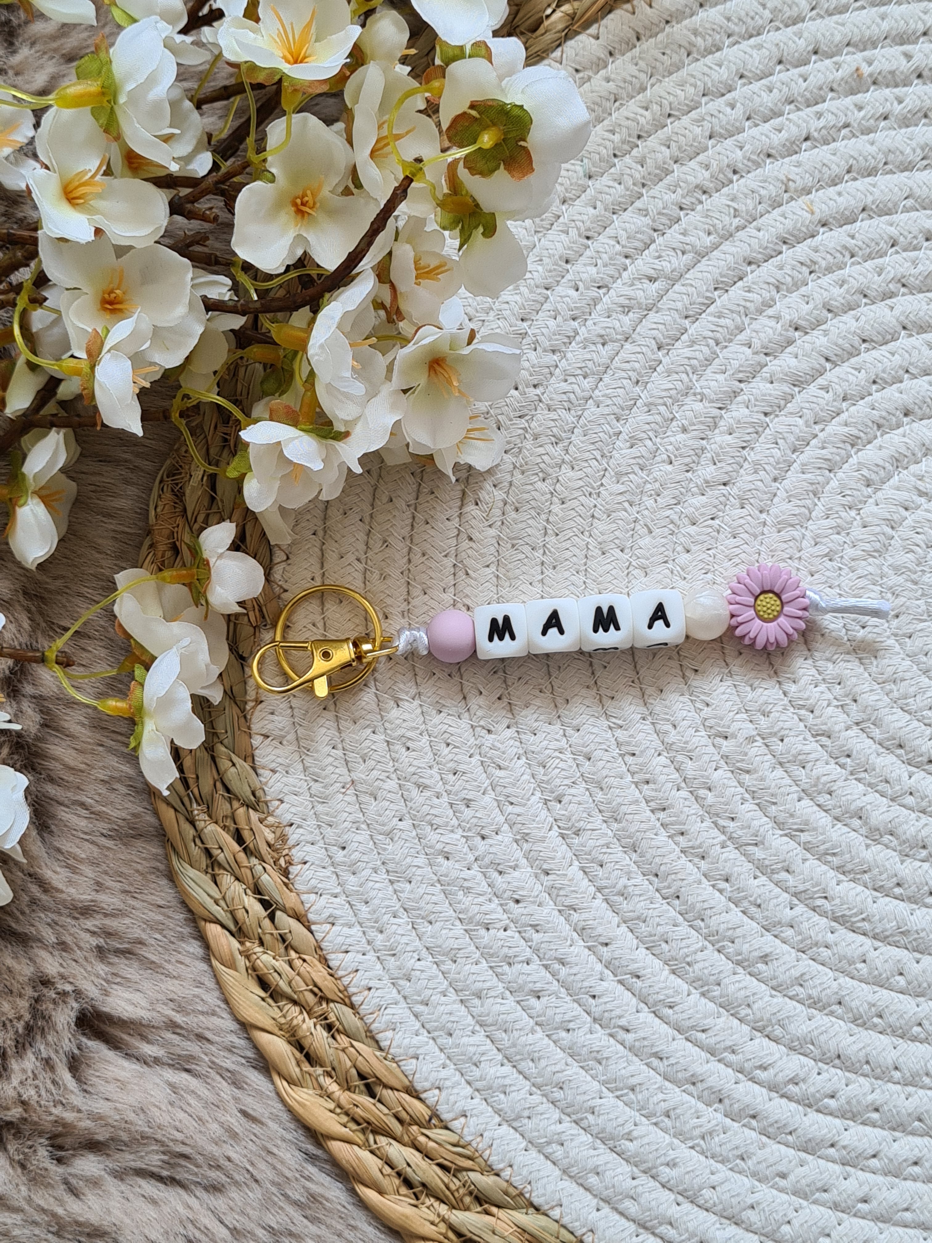Sleutelhanger met bloem lila met pareltje