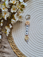 Sleutelhanger met bloem beige met mauve accent