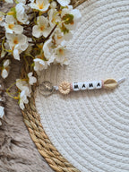 Sleutelhanger met bloem beige met mauve accent