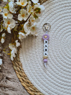 Sleutelhanger met bloem lila en beige